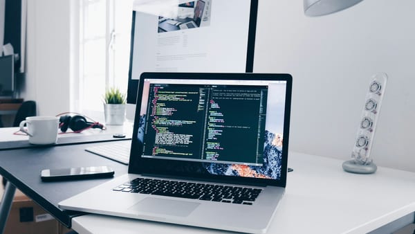Developer laptop open to a browser-based fullscreen display test