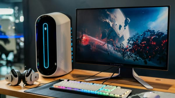 Ultrawide monitor on a workspace used for brightness uniformity testing